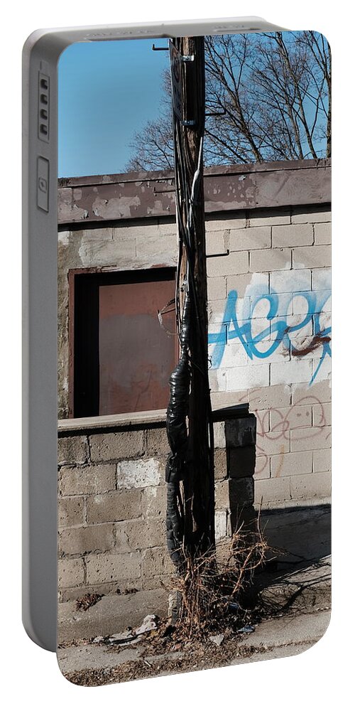 Urban Portable Battery Charger featuring the photograph Small Shack, Short Wall And A Pole by Kreddible Trout