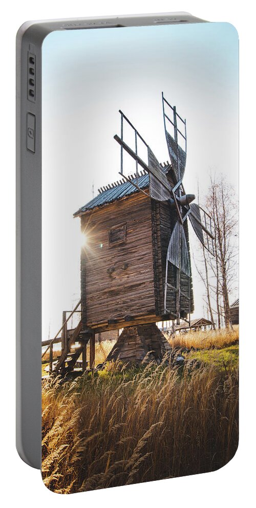 Medieval Portable Battery Charger featuring the photograph Small wooden mill with beautiful sun star by Vaclav Sonnek