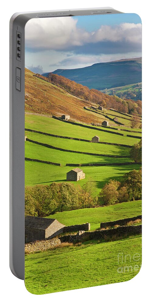 Yorkshire Dales National Park Portable Battery Charger featuring the photograph Stone barns in Swaledale, Yorkshire Dales, England by Neale And Judith Clark