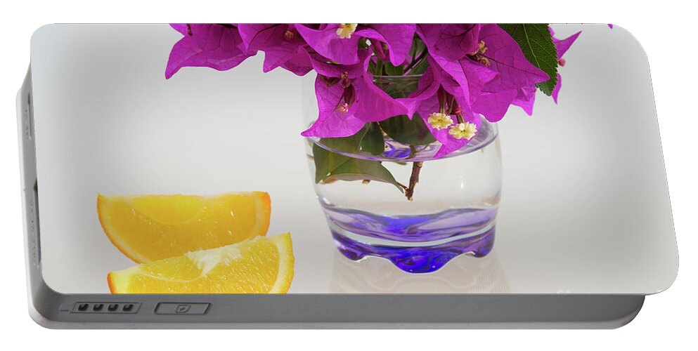Orange Portable Battery Charger featuring the photograph Sunny yellow orange slices and pink flowers by Adriana Mueller