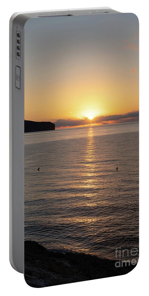 Sunrise Portable Battery Charger featuring the photograph Sunrise on the Mediterranean coast in Spain by Adriana Mueller