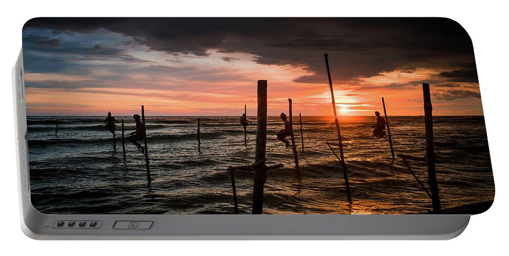 Fisherman Portable Battery Charger featuring the photograph Sunset and Stilt Fishermen by Arj Munoz