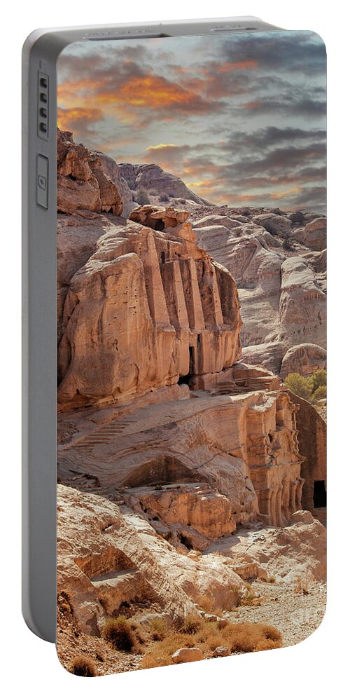 Petra Portable Battery Charger featuring the photograph Sunset at the lost city of Petra, Jordan. Amazing buildings are carved out of the pink rock and the Rose City dates to around 300 BC by Jane Rix