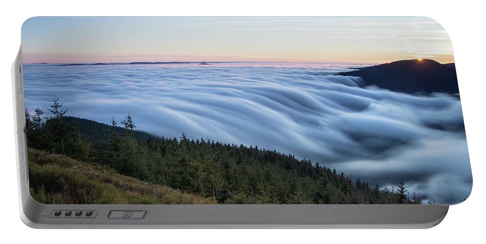 Courage Portable Battery Charger featuring the photograph Sunset with floating blue waves of clouds by Vaclav Sonnek