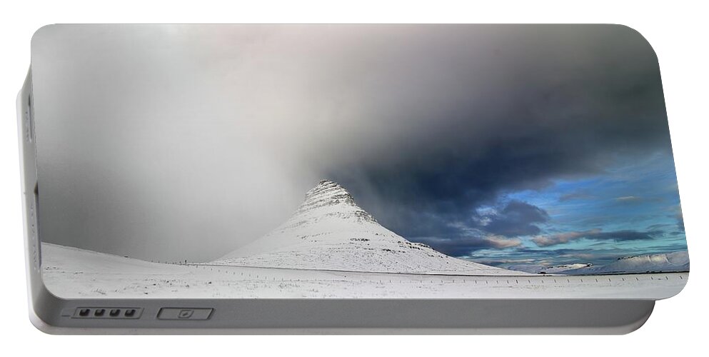 Iceland Portable Battery Charger featuring the photograph The cloak of winter by Christopher Mathews