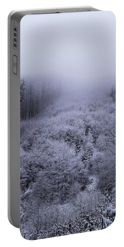 Beskydy Portable Battery Charger featuring the photograph The last remnants of the snow cover, together with the impenetrable fog, create a wonderful mystical atmosphere. Freak of winter nature. Haze is coming down from mountain to valley by Vaclav Sonnek