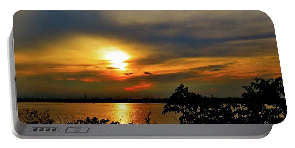 Sunset Portable Battery Charger featuring the photograph The Sun Going Down Over the Delaware River by Linda Stern
