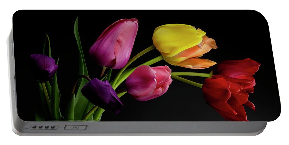 Tulips Portable Battery Charger featuring the photograph Tulips in a vase with dramatic lighting and dark background by Art Whitton