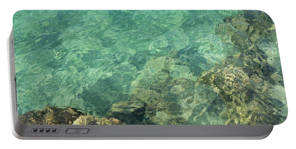 Turquoise Portable Battery Charger featuring the photograph Turquoise blue water on the Mediterranean coast by Adriana Mueller