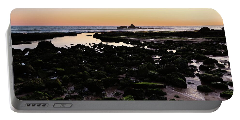 Low Tide Portable Battery Charger featuring the photograph Twilight and rocks in Gale beach by Angelo DeVal