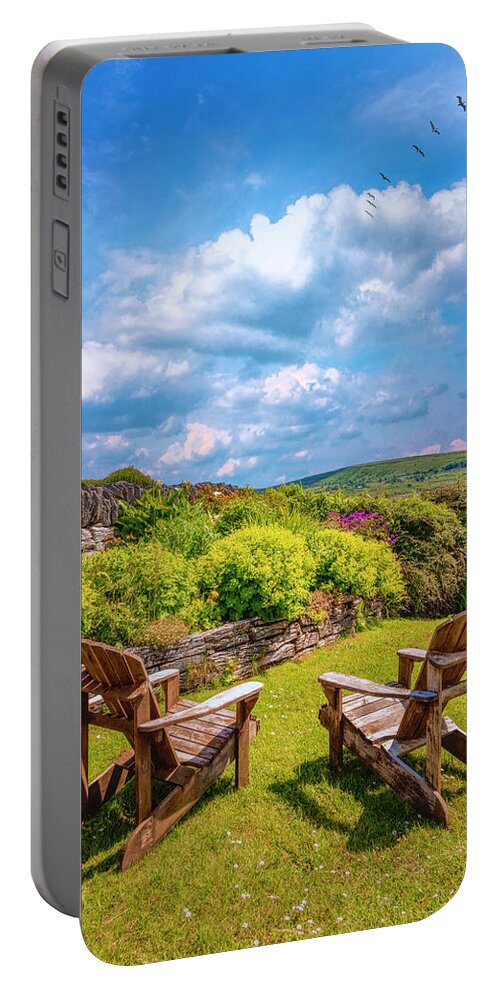 Clouds Portable Battery Charger featuring the photograph Two Chairs in the Garden by Debra and Dave Vanderlaan