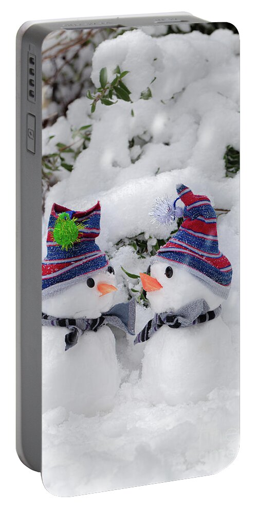 Snowman Portable Battery Charger featuring the photograph Two cute little snowmen dressed for snow by Simon Bratt