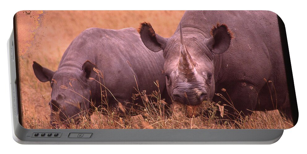 Africa Portable Battery Charger featuring the photograph Two Rhinos Eating by Russel Considine