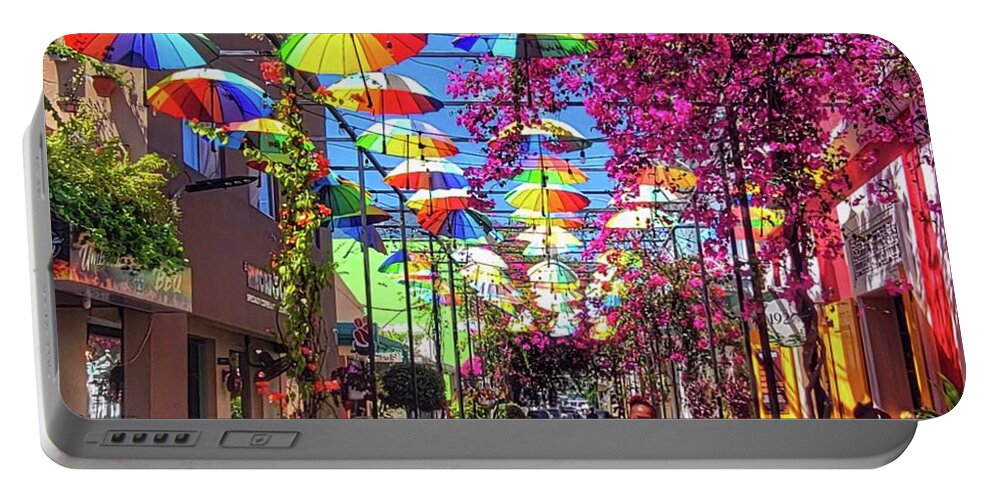 Puerto Plata Portable Battery Charger featuring the photograph Umbrella Street by Suzanne Stout