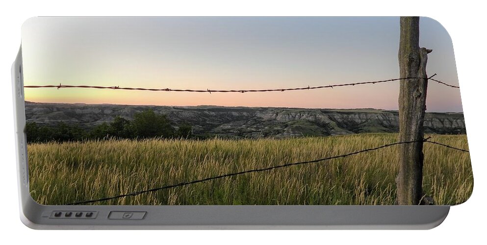 Badlands Portable Battery Charger featuring the photograph View Through The Fence by Amanda R Wright