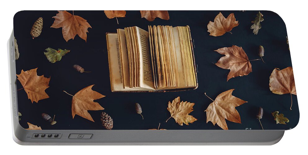 Autumn Portable Battery Charger featuring the photograph Vintage book and autumn maple leaves on dark background from abo by Jelena Jovanovic
