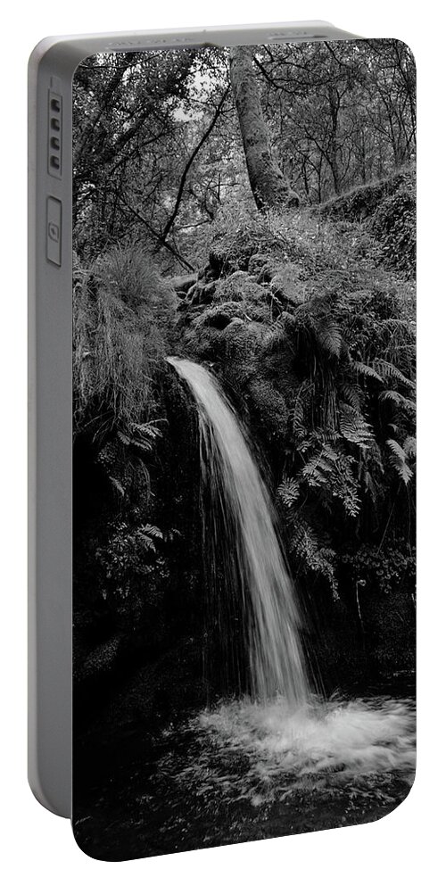 Nature Portable Battery Charger featuring the photograph Waterfall in the middle of Carvalhais forest. Monochrome by Angelo DeVal