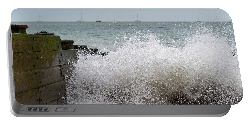 Eastbourne Portable Battery Charger featuring the photograph Wave splash by Andrew Lalchan