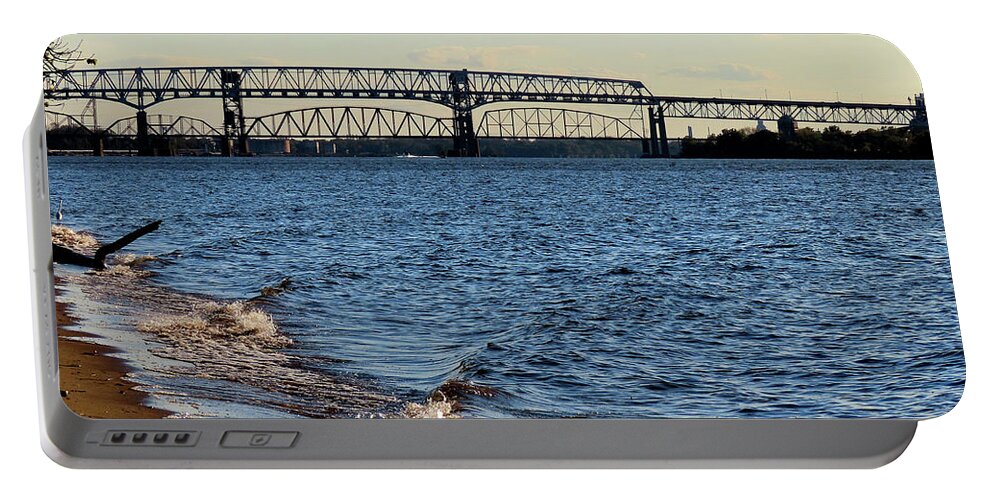 River Portable Battery Charger featuring the photograph Waves Lapping the Shore of the Delaware River Near Betsy Ross and Delair Memorial Railroad Bridges by Linda Stern