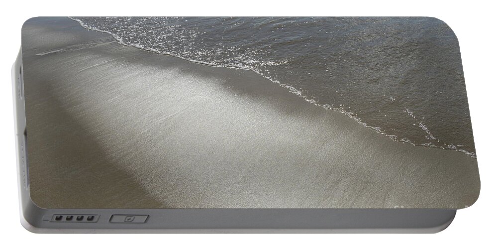Sandy Beach Portable Battery Charger featuring the photograph Wet sand, sea water and reflections of sunlight 2 by Adriana Mueller