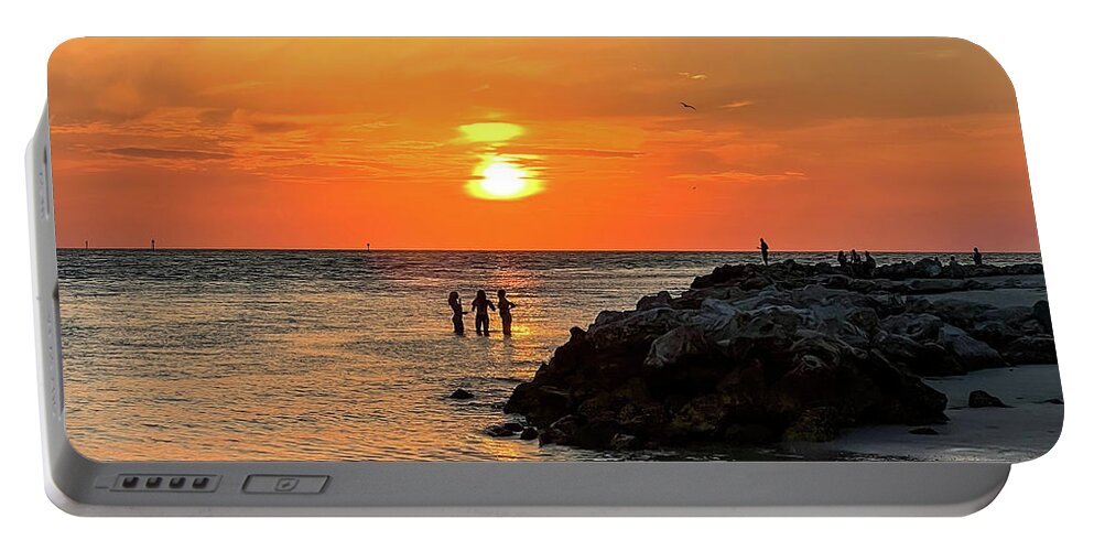 Clearwater Beach Sunset Portable Battery Charger featuring the photograph When The Sun Goes Down by Kerri Farley