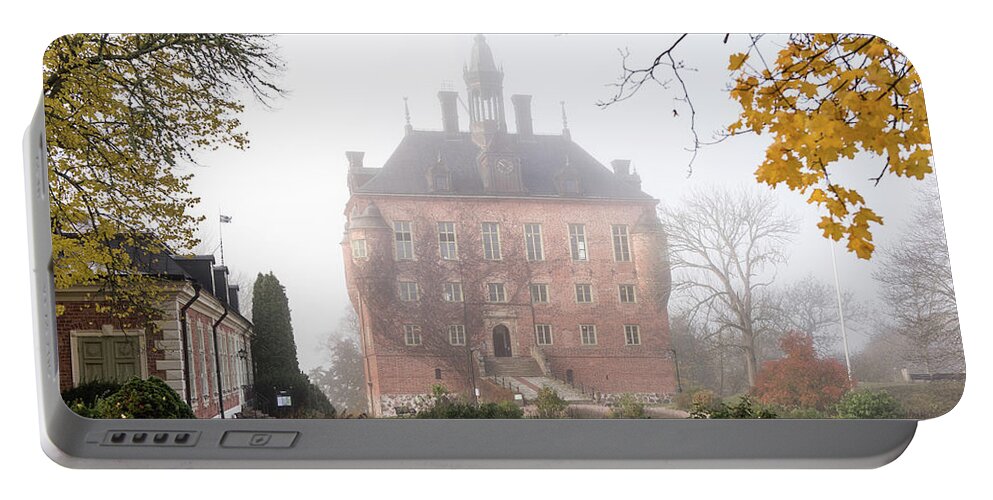 Wik Castle Portable Battery Charger featuring the photograph Wik Castle a foggy autumn morning by Torbjorn Swenelius