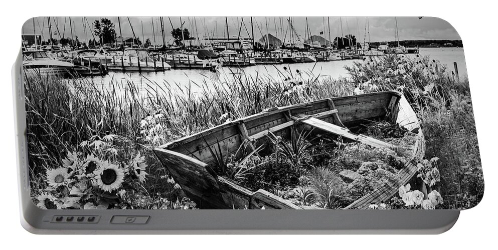 Black Portable Battery Charger featuring the photograph Wildflowers Rowboat in the Harbor Black and White by Debra and Dave Vanderlaan