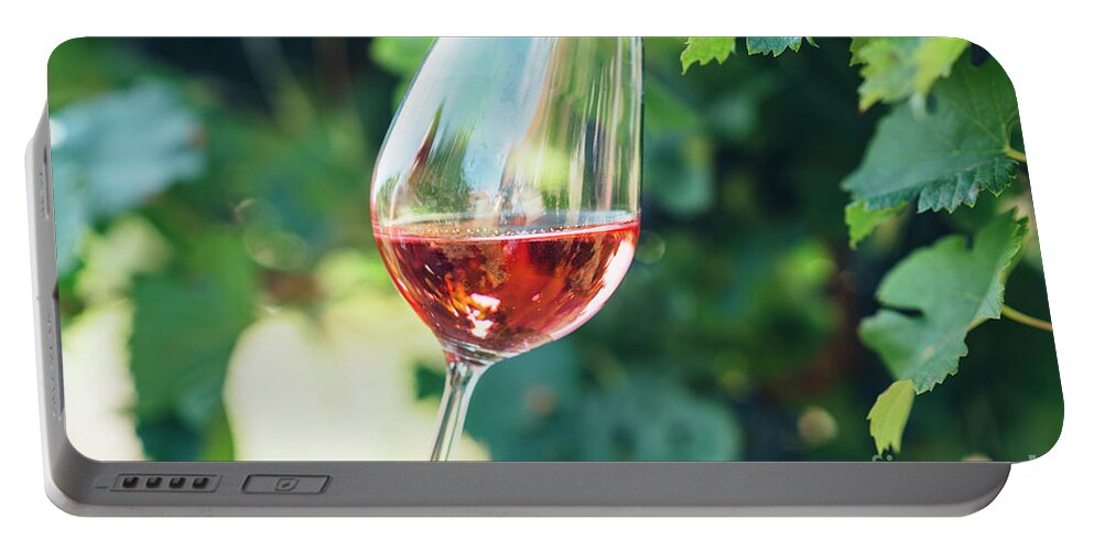 Wine Portable Battery Charger featuring the photograph Wine tasting in outdoor winery. by Jelena Jovanovic