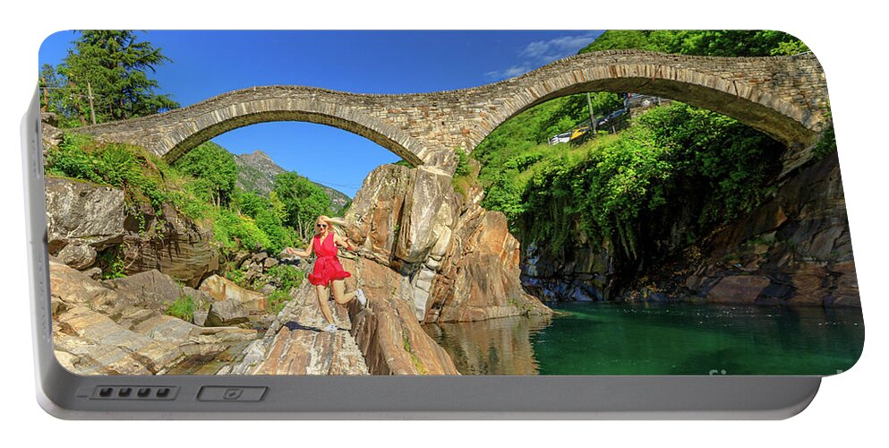 Switzerland Portable Battery Charger featuring the photograph woman running at Ponte dei Salti Bridge by Benny Marty