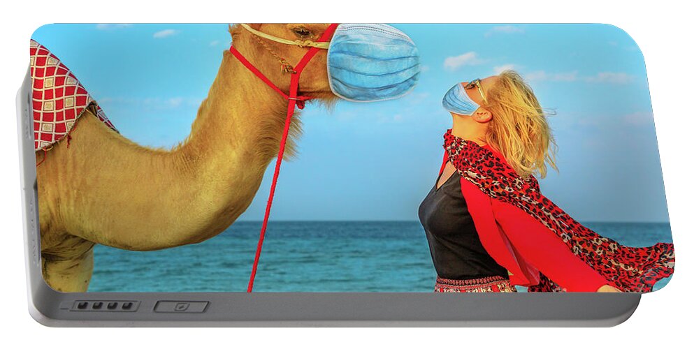 Camel Portable Battery Charger featuring the photograph Woman with camel at Covid 19 by Benny Marty