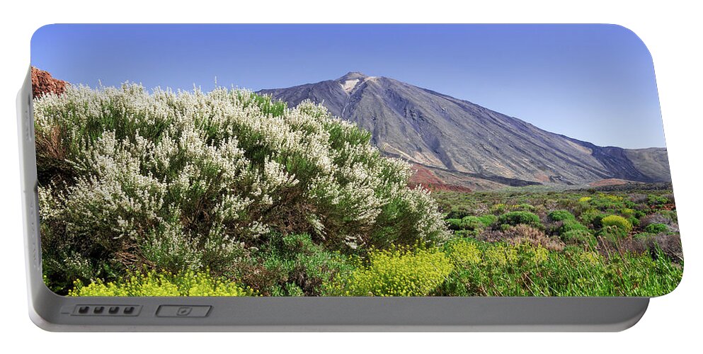 Mountains Portable Battery Charger featuring the photograph Yellow and white flowering shrubs in front of Mount Teide by Sun Travels