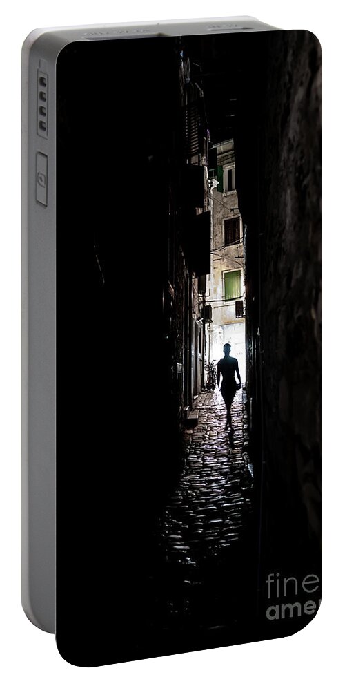  Portable Battery Charger featuring the photograph Young Woman Walks Alone Through Spooky Narrow Abandoned Alley In The Night by Andreas Berthold