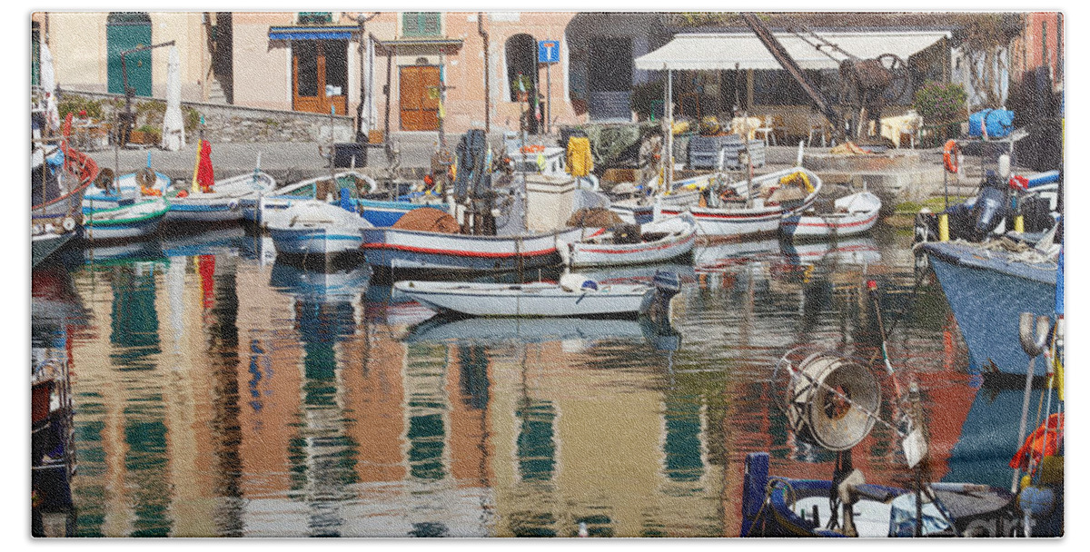 Boat Beach Towel featuring the photograph fishing boats in Camogli #1 by Antonio Scarpi