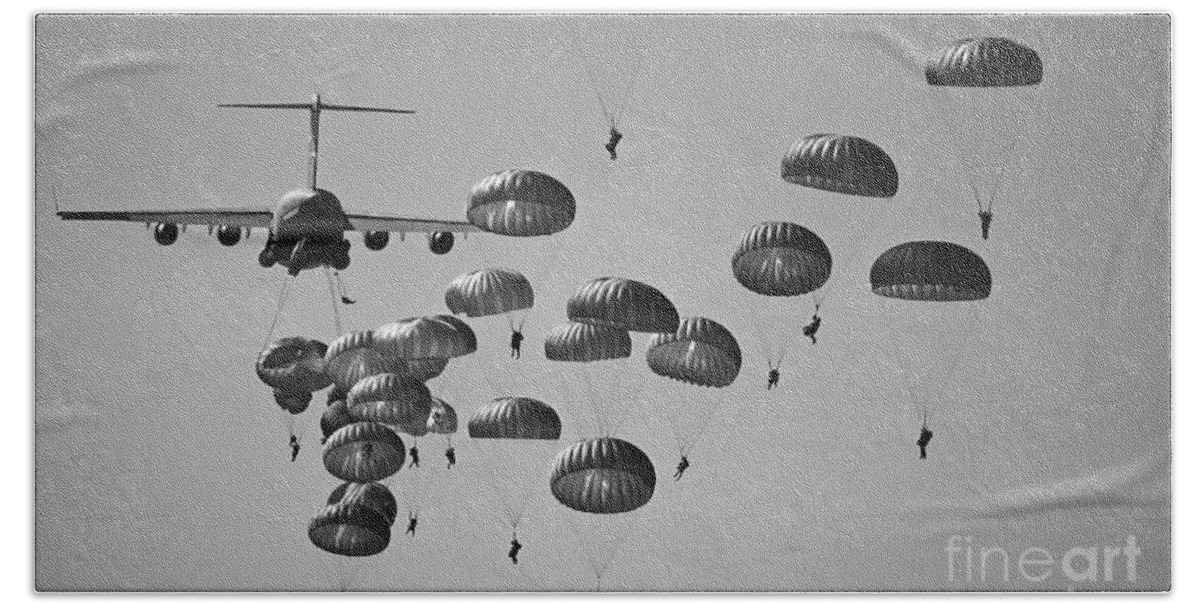Parachutist Beach Towel featuring the photograph U.s. Army Paratroopers Jumping #1 by Stocktrek Images