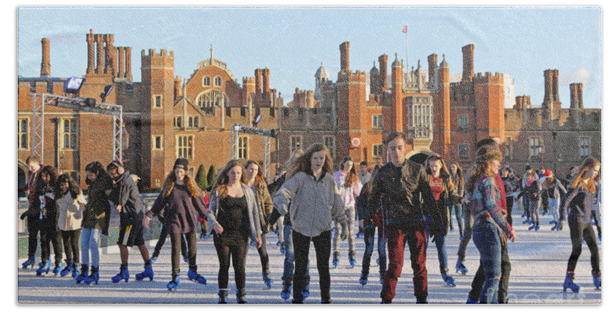 Ice Skating At Hampton Court Palace Ice Rink England Uk Beach Towel featuring the photograph Ice skating at Hampton Court Palace ice rink England UK #13 by Julia Gavin