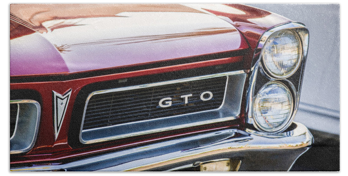 1965 Pontiac Gto Grille Emblem Beach Towel featuring the photograph 1965 Pontiac GTO Grille Emblem -0442c by Jill Reger