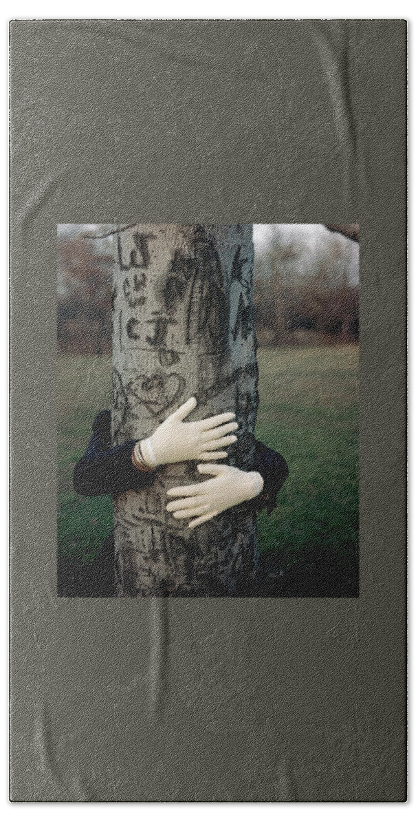 A Model Hugging A Tree Beach Towel