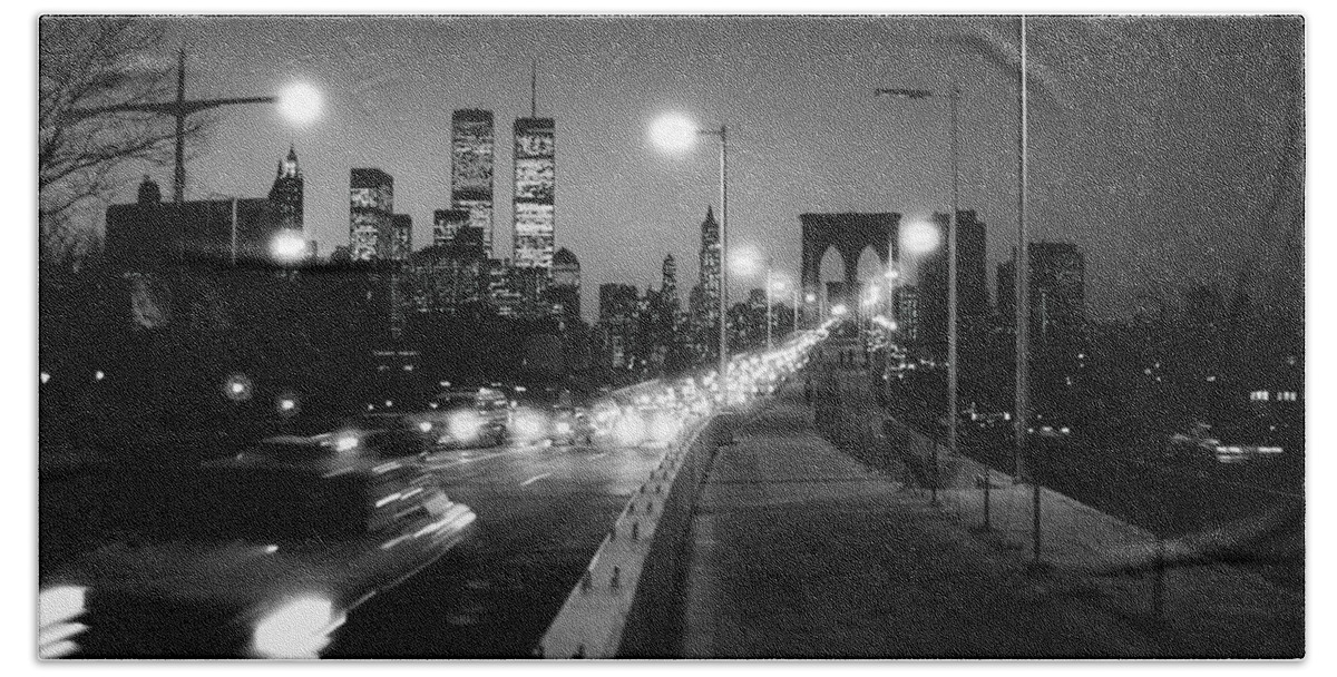 1980s Beach Towel featuring the photograph Brooklyn Bridge and Manhattan skyline at dusk 1980s by Gary Eason