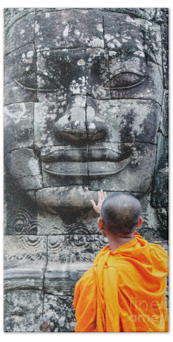 Buddha Beach Towel featuring the photograph Cambodia - Angkor Wat - Monk touching giant Buddha statue by Matteo Colombo