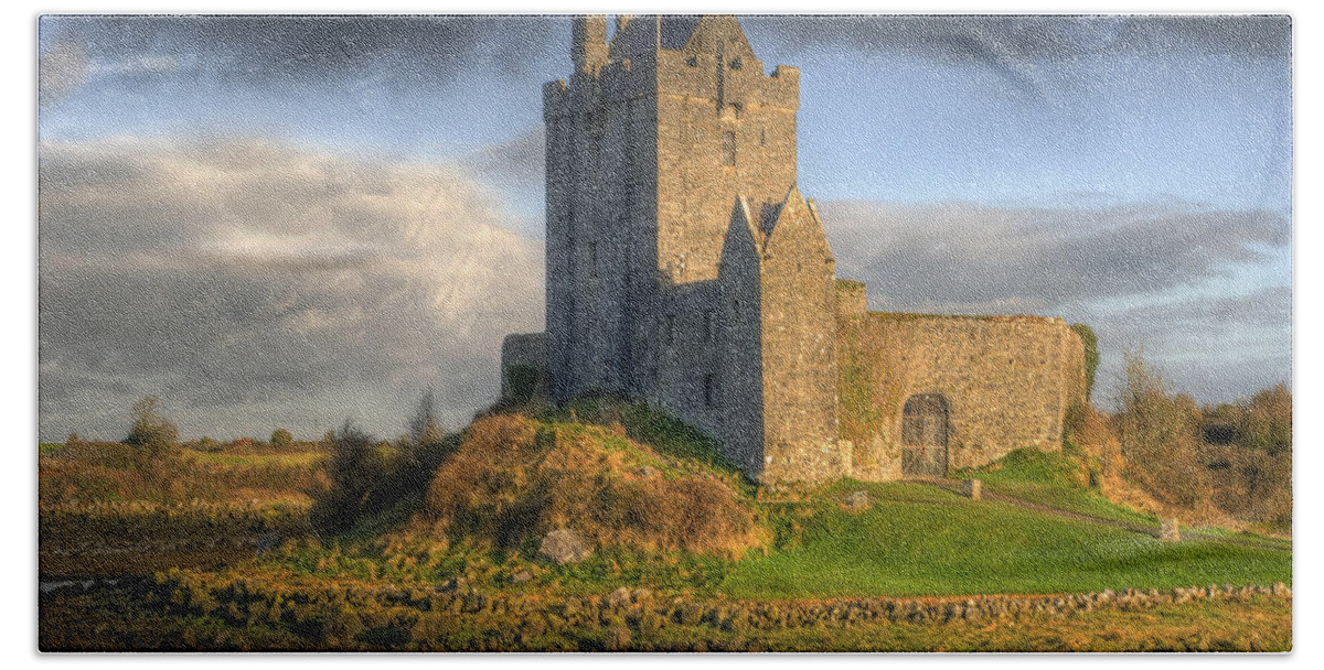 Ancient Beach Towel featuring the photograph Dunguaire Castle with Dramatic Sky Kinvara Galway Ireland by Juli Scalzi