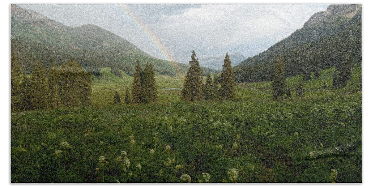 Rainbow Beach Towel featuring the photograph Evening Rainbow in the Rocky Mountains by Cascade Colors