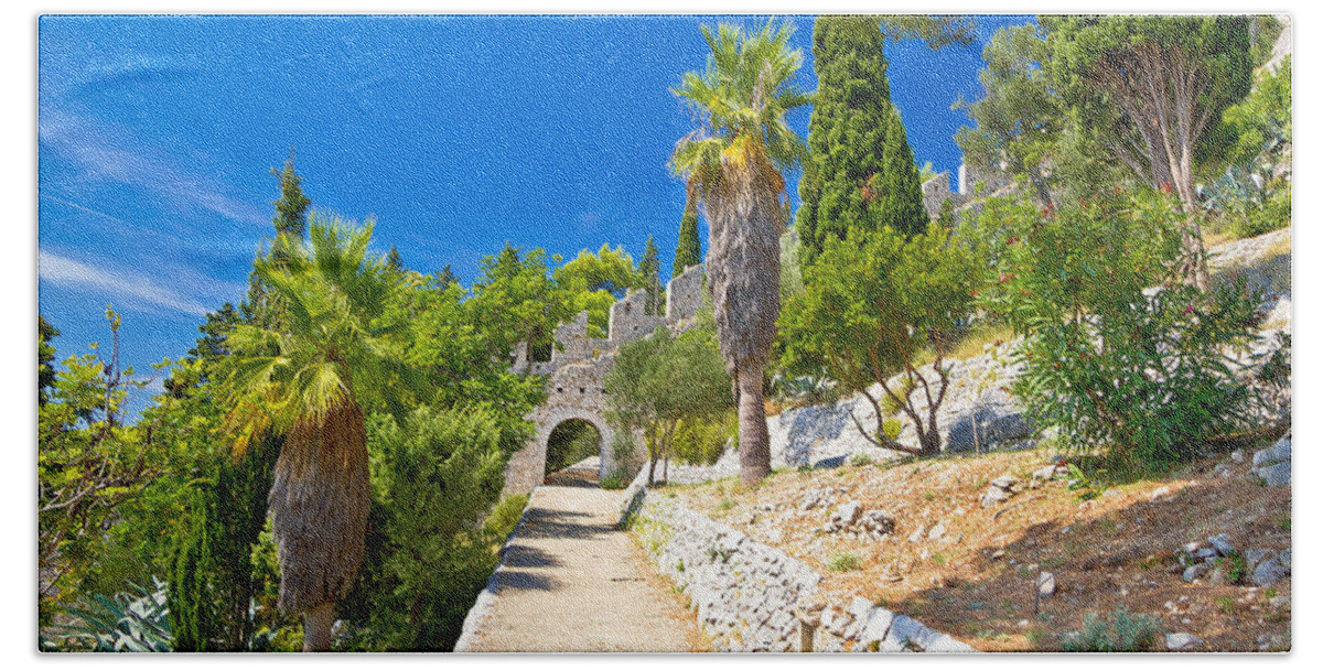 Hvar Beach Towel featuring the photograph Historic Hvar fortification wall in nature by Brch Photography