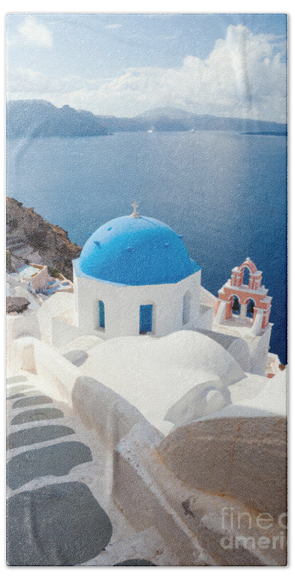 Santorini Beach Towel featuring the photograph Iconic blue domed churches in Santorini - Greece by Matteo Colombo