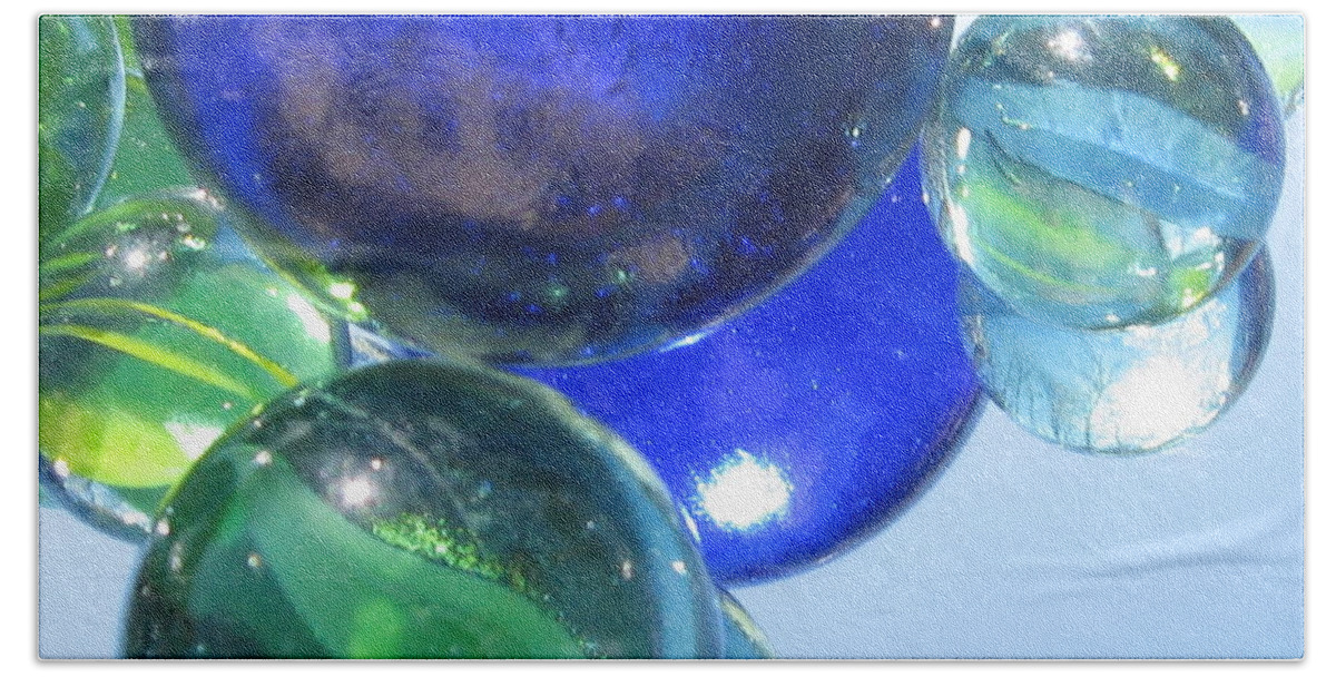 Photograph Beach Towel featuring the photograph Mirrored Marbles by Tracy Male