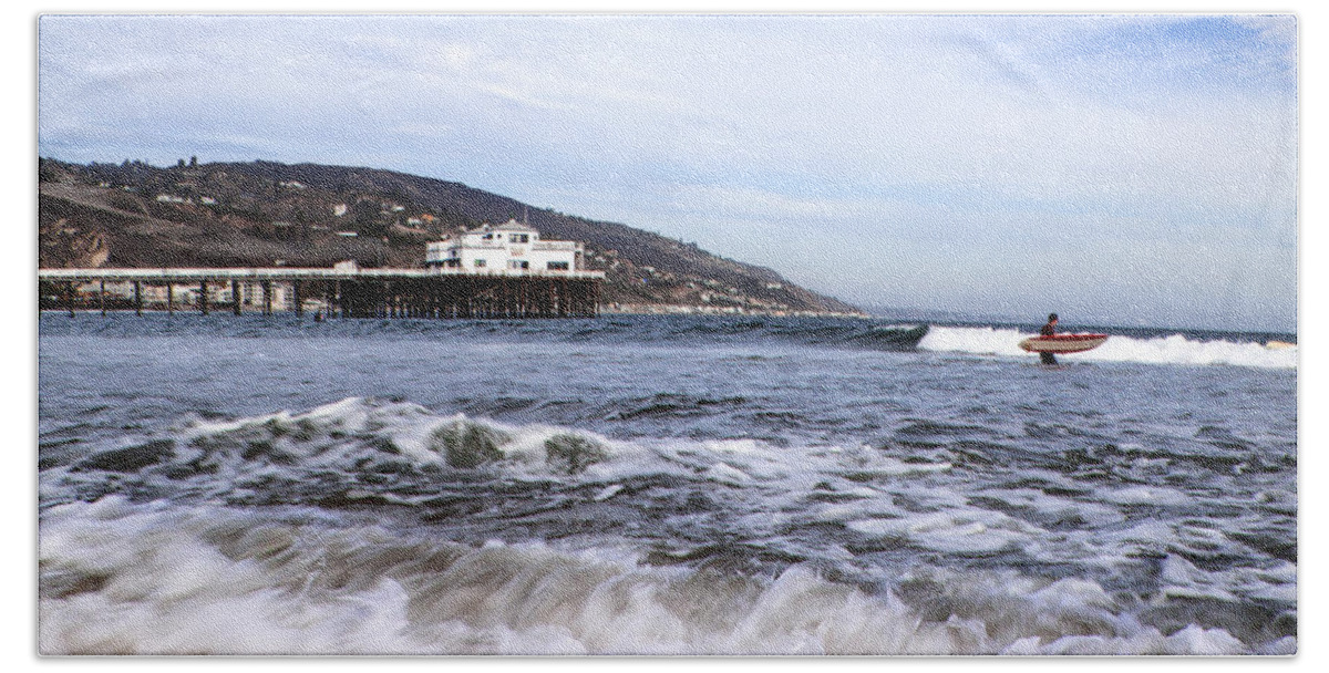Malibu Beach Pier Photographs Beach Towel featuring the photograph Ocean Waves Blue Sky And A Surfer At Malibu Beach Pier by Jerry Cowart