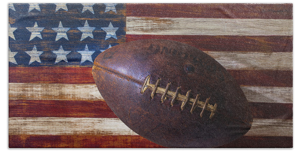 Football Beach Towel featuring the photograph Old Football On American Flag by Garry Gay