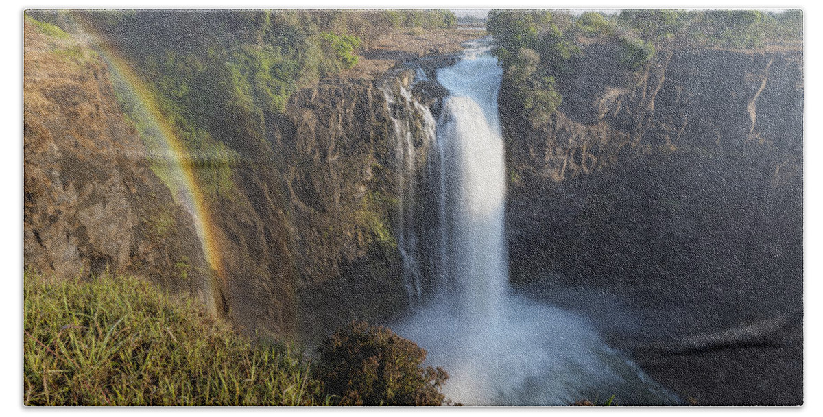Vincent Grafhorst Beach Towel featuring the photograph Rainbow In The Mist Of Victoria Falls by Vincent Grafhorst