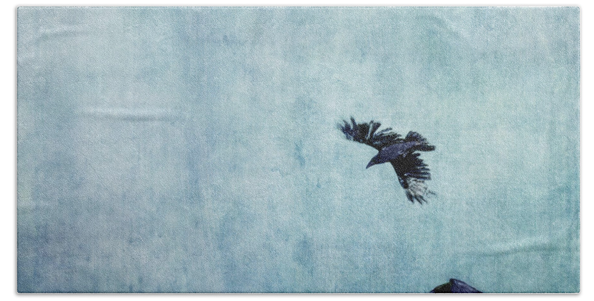 Minimalistic Beach Towel featuring the photograph Ravens flight by Priska Wettstein