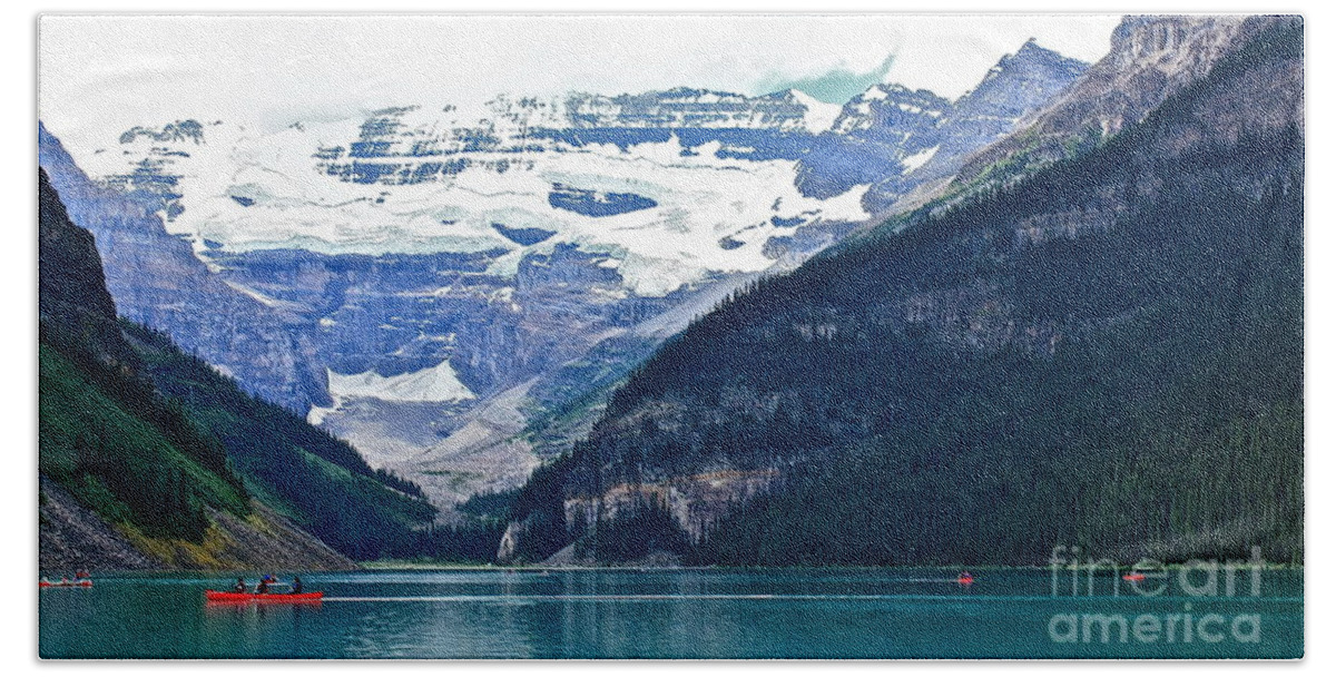 Lake Louise Alberta Red Beach Towel featuring the photograph Red Canoes Turquoise Water by Linda Bianic