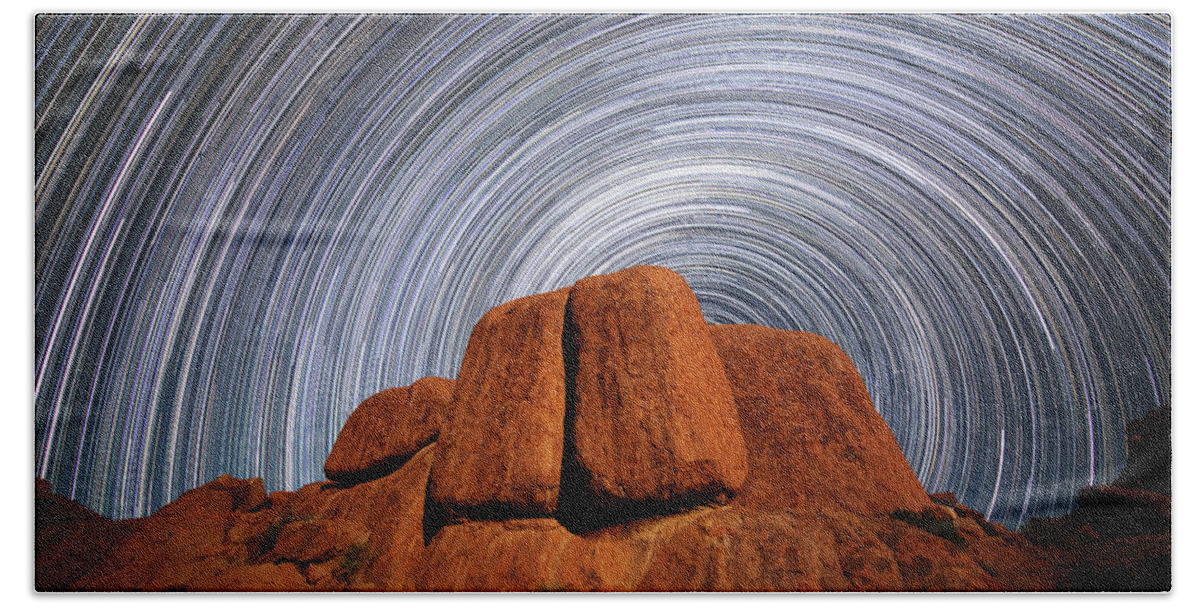 Blur Beach Towel featuring the photograph Star Trails Above A Large Boulder by Robert Postma
